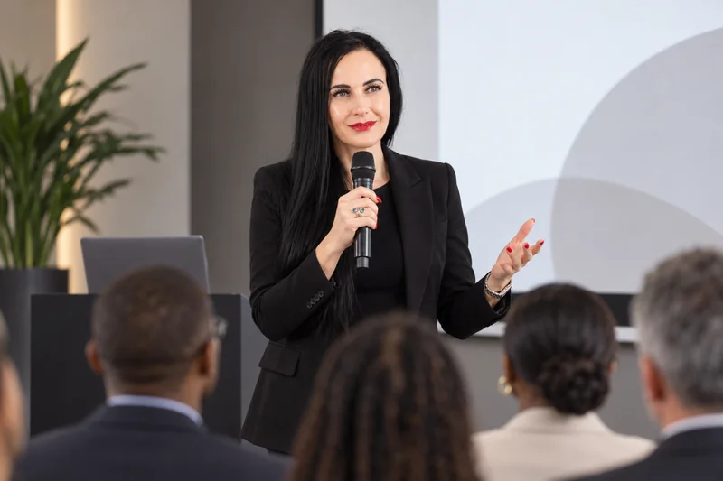 Illustrative public speaking scene featuring Cornell Meeks, generated from her portrait